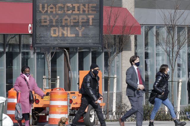 Javits K. Center opens as COVID-19 vaccine mega-site. Sign reads: Vaccine by appt only.